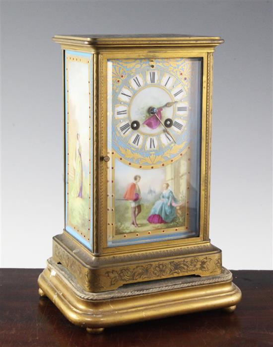 An early 20th century ormolu and jewelled porcelain four glass mantel clock, 10in.